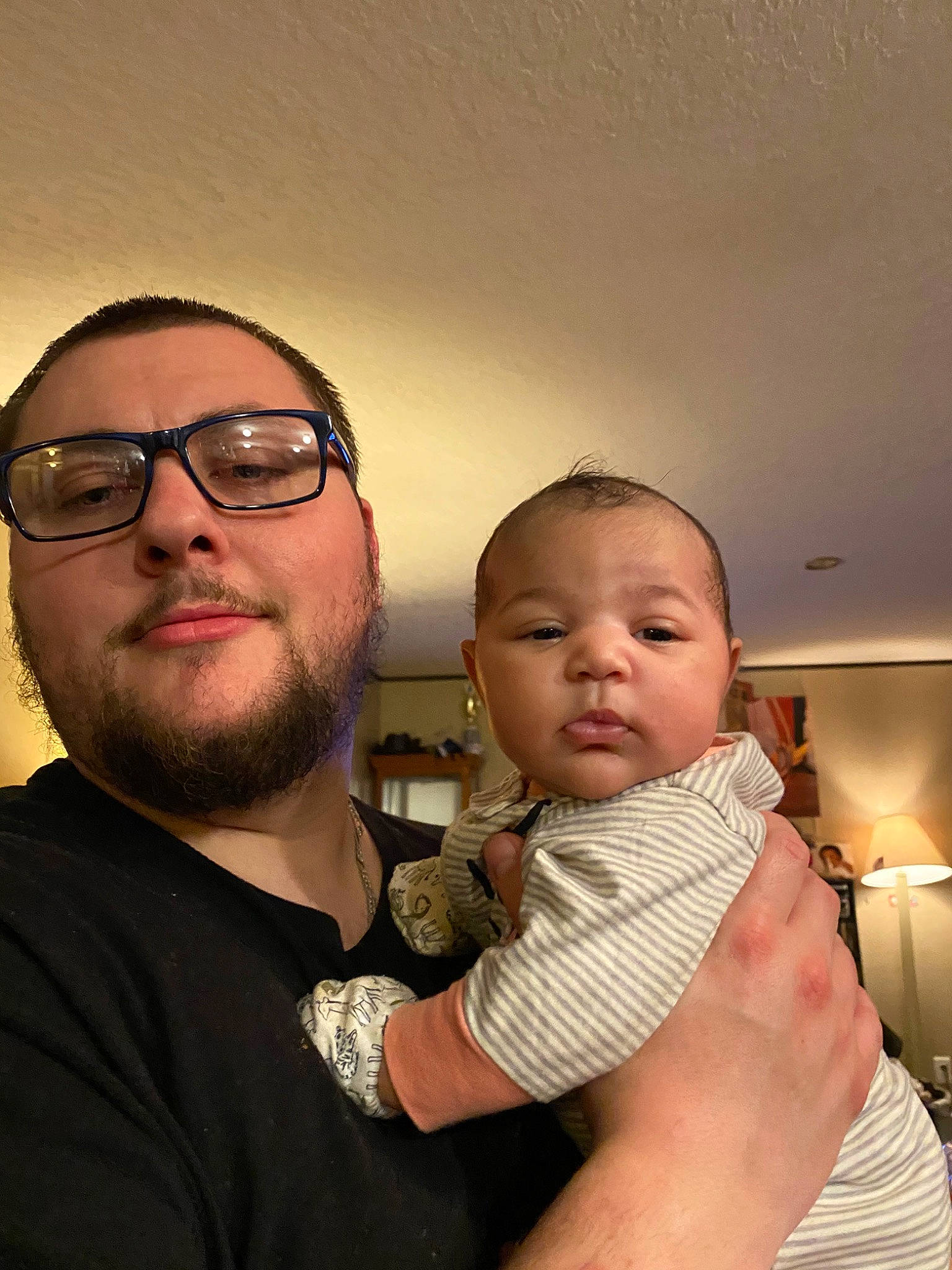 Persephone is registered to the contest to win money with this photo: arm, beard, child, eyewear, facial_hair, fathers_day, finger, fun, glasses, head, moustache, muscle, person, smile, thumb, toddler, vision_care