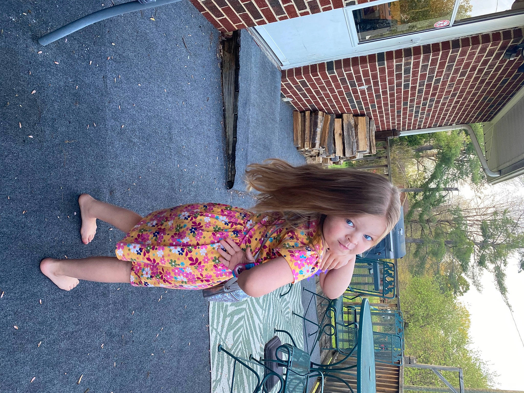 Allie is registered to the contest to win money with this photo: asphalt, beauty, design, fun, grass, happy, human_leg, leisure, line, magenta, pattern, person, pink, road_surface, roof, sandal, sitting, summer, tints_and_shades, tree