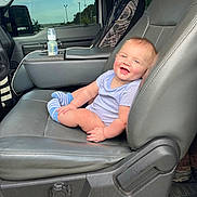 Christopher joined the competition — help win amazing prizes! baby, infant, car_seat, smiling, blue_socks, onesie, baby_bottle, vehicle_interior, gray_seat, window, daylight, happy, child, portrait, seat_belt, car_door, dashboard, road_trip, inside_car, seat_adjustment_knob