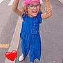 Ashley participe au concours pour gagner de l'argent avec cette photo : child, girl, blue_outfit, pink_cap, glasses, smiling, happy, street, sidewalk, urban, celebration, finger_pointing, white_shoes, curly_hair, bracelets, daytime, outdoor, road, crosswalk, heart_emoji