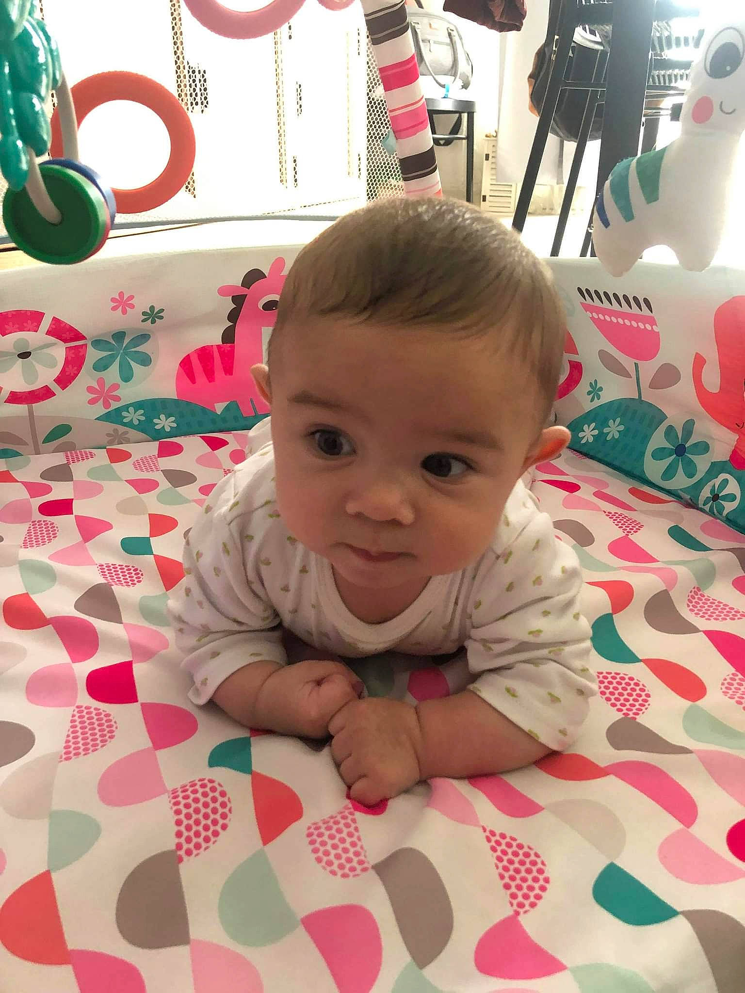 Abbygaëlle participe au concours pour gagner de l'argent avec cette photo : baby, baby_toddler_clothing, cheek, facial_expression, floor, flooring, green, hairstyle, happy, iris, nose, organ, person, pink, product, red, skin, smile, textile, toddler