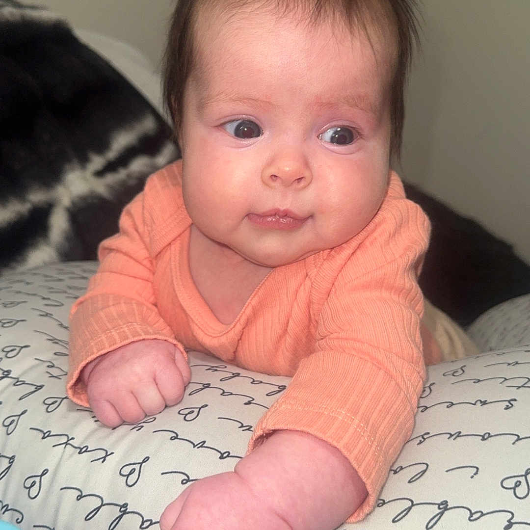 Vivian joined the competition — help win amazing prizes! baby, bed, bedroom, bodypart, clothing, couch, cushion, face, finger, furniture, hand, head, homedecor, indoors, newborn, person, photography, portrait, room, sitting