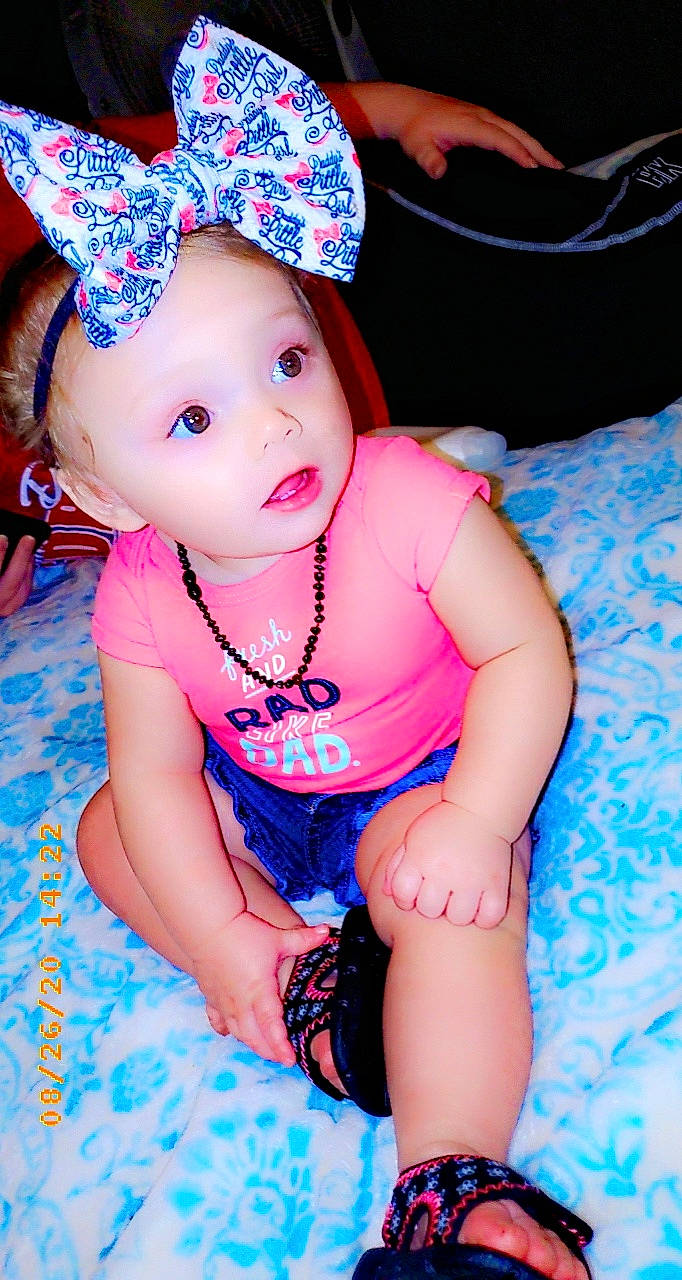 Aryah joined the competition — help win amazing prizes! baby, baby_toddler_clothing, cheek, child, child_model, costume_accessory, fashion_accessory, hair_accessory, hat, headband, headgear, headwear, lip, person, pink, skin, smile, surprise, toddler