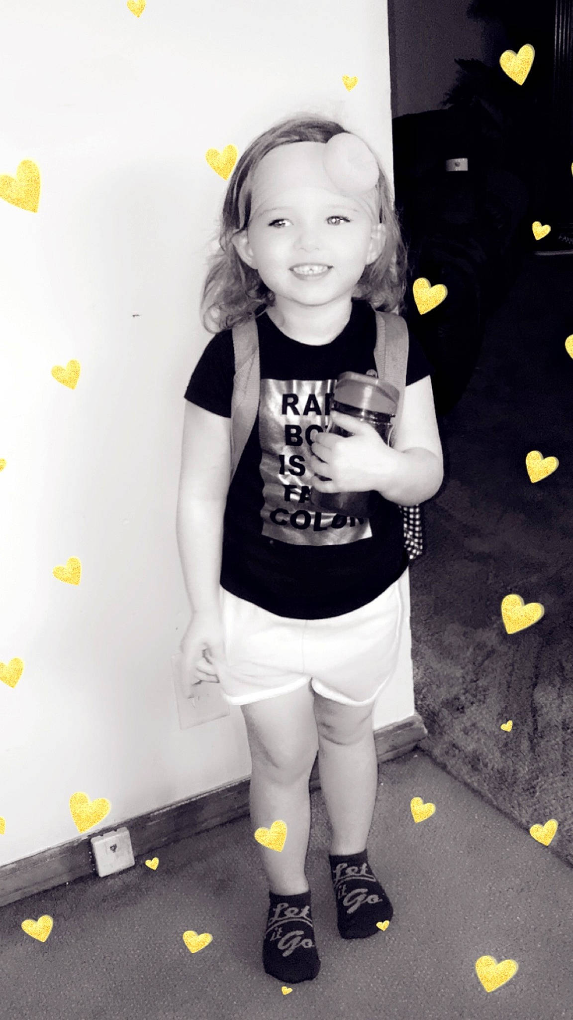 Gracelynn is registered to the contest to win money with this photo: black_and_white, child, child_model, footwear, happy, joy, knee, leg, leggings, person, photography, play, shoe, shorts, sleeve, smile, snapshot, style, t_shirt, tights
