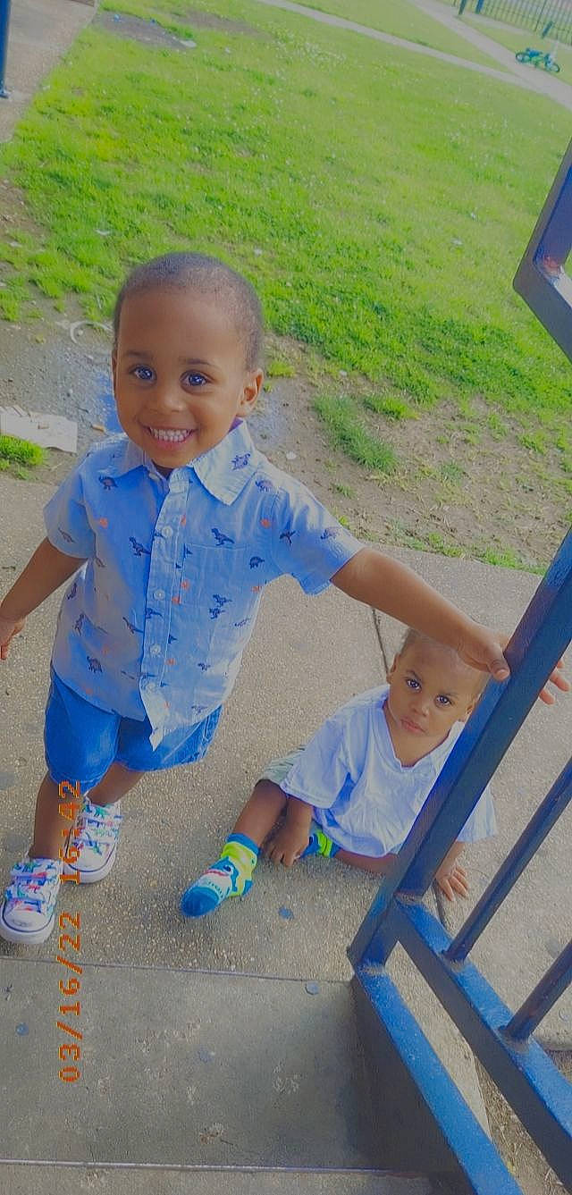 Lamarion is registered to the contest to win money with this photo: azure, baby, baby_toddler_clothing, blue, child, eye, face, fun, grass, happy, joy, leaf, leisure, outdoor_furniture, people_in_nature, person, recreation, skin, smile, standing