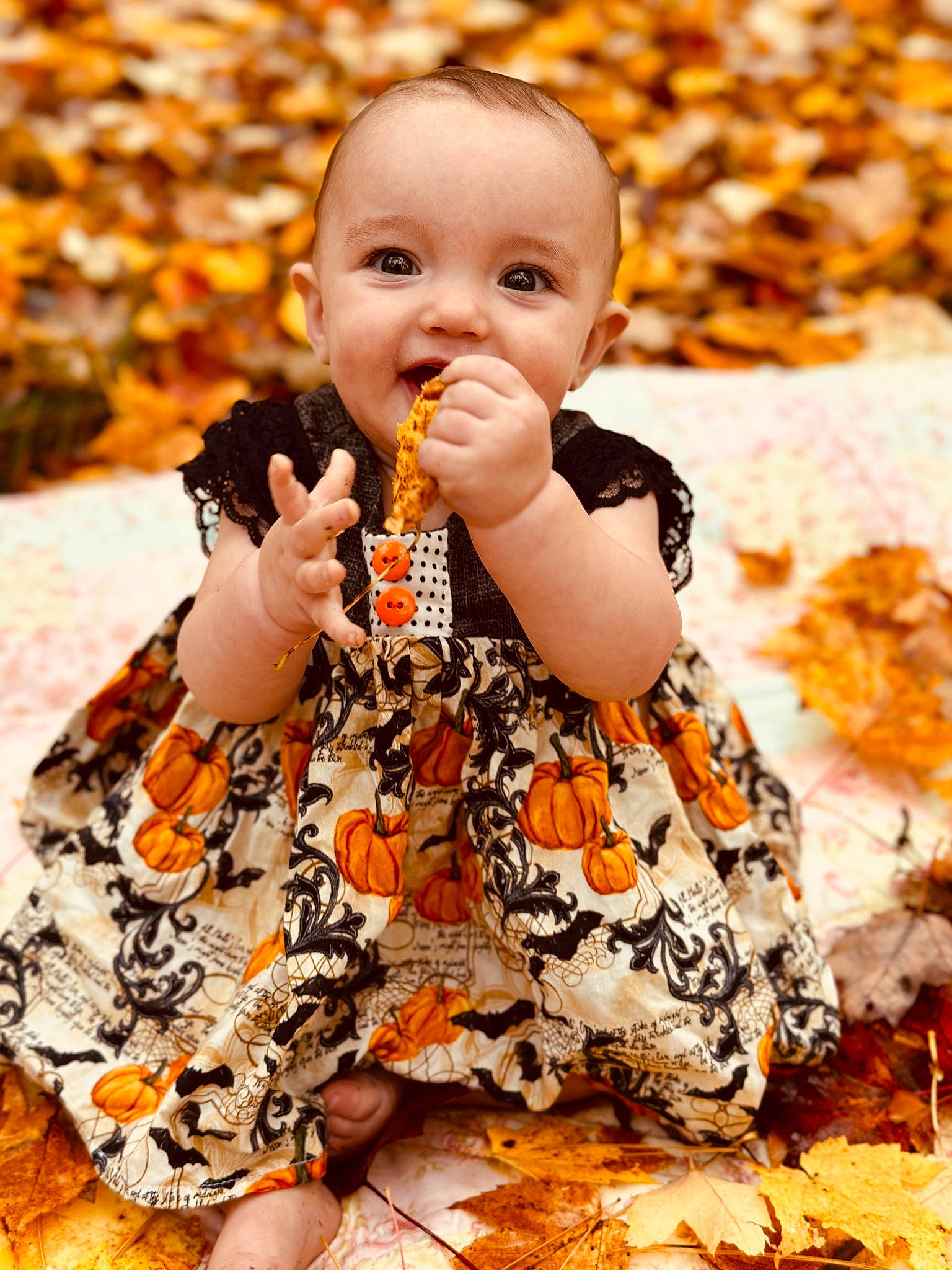 Lilah joined the competition — help win amazing prizes! baby, baby_toddler_clothing, cheek, child, eye, finger, fun, gesture, grass, happy, head, orange, pattern, people, people_in_nature, person, photograph, portrait_photography, sitting, sleeve
