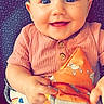 Meadow Rose joined the competition — help win amazing prizes! baby, smiling, blue_eyes, pink_clothing, toy, soft_toy, infant, cute, happy, child, patterned_background, sitting, closeup, portrait, indoors, baby_girl, playful, bright_eyes, cheerful, small_hands