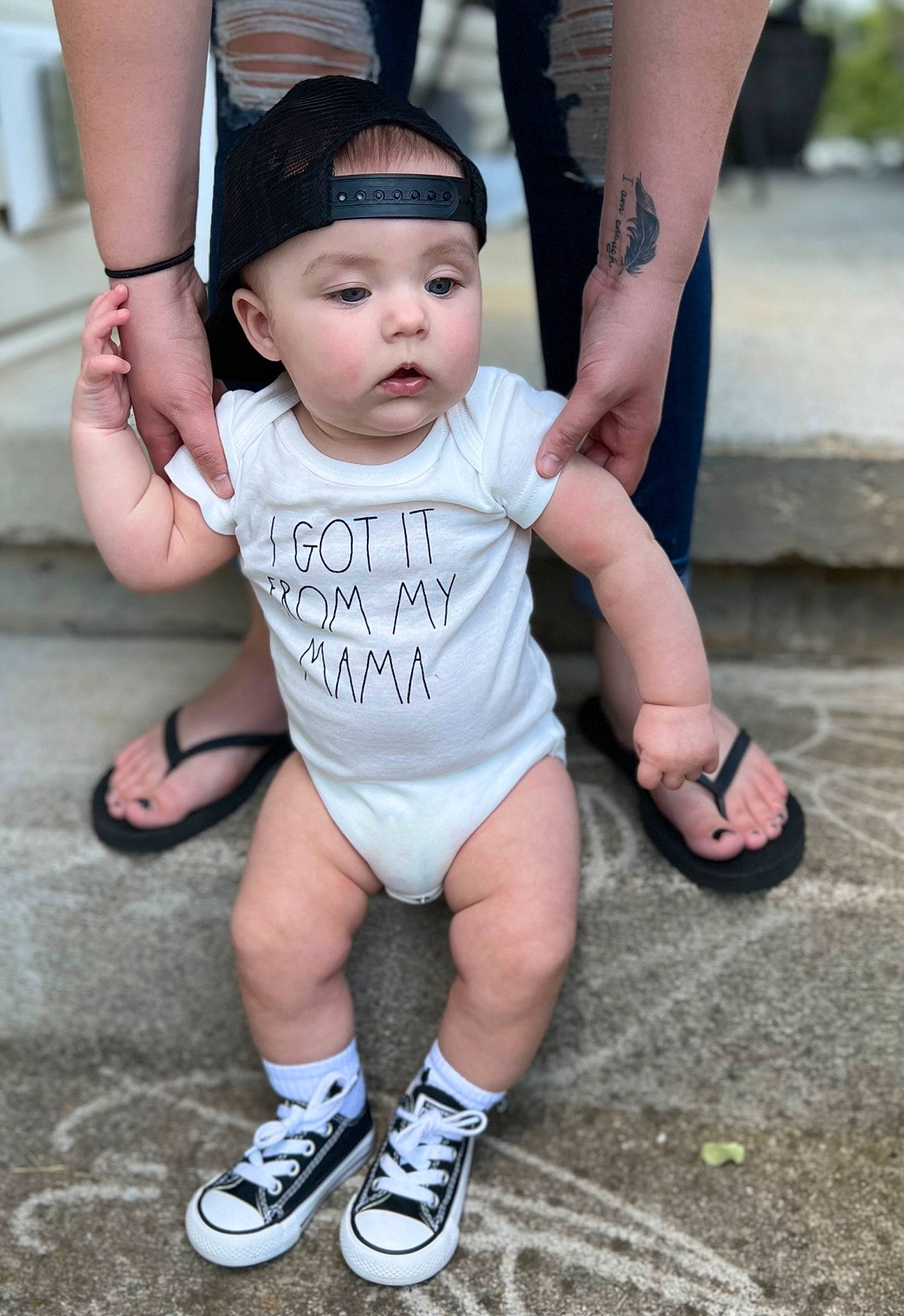 Kannon joined the competition — help win amazing prizes! baby, baby_toddler_clothing, child, fun, gesture, happy, hat, headwear, human_leg, leg, leisure, people, person, recreation, shoe, sitting, sleeve, sneakers, style, t_shirt