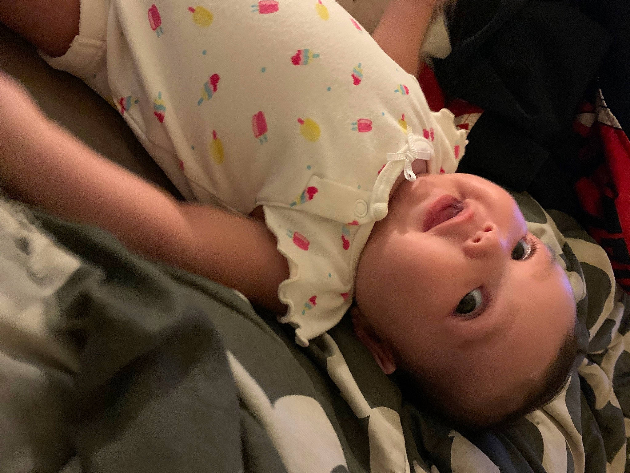 Shaniya is registered to the contest to win money with this photo: abdomen, baby, baby_toddler_clothing, cheek, child, comfort, elbow, finger, fun, gesture, grass, happy, human, mammal, mouth, pattern, people, person, skin, toddler