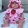 Martha participe au concours pour gagner de l'argent avec cette photo : baby, child, clothing, curious, cute, dress, floor, foot, furniture, hand, hat, indoor, infant, person, pink, portrait, rug, sitting, strawberry, young