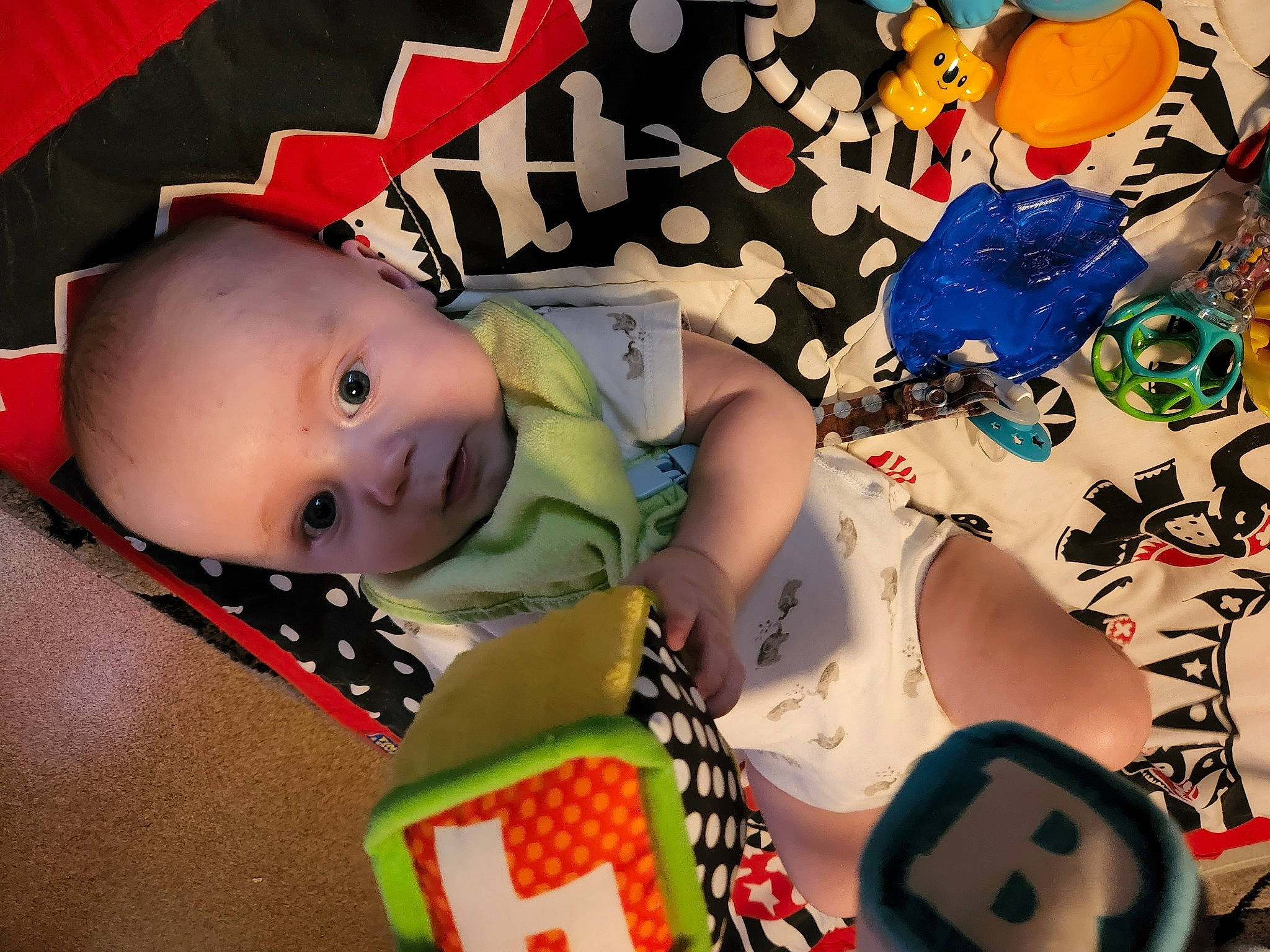 Caleb is registered to the contest to win money with this photo: art, baby, baby_products, baby_toddler_clothing, carmine, cheek, child, clothing, fictional_character, fun, happy, linens, pattern, person, room, sleeve, textile, toddler, visual_arts