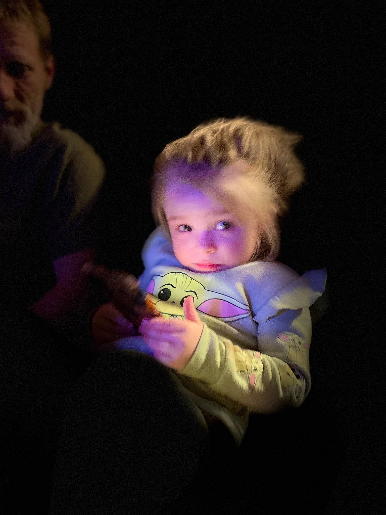 Chesney is registered to the contest to win money with this photo: baby, cheek, child, darkness, ear, electric_blue, entertainment, event, flash_photography, fun, happy, iris, magenta, night, performance, person, purple, room, sitting, t_shirt