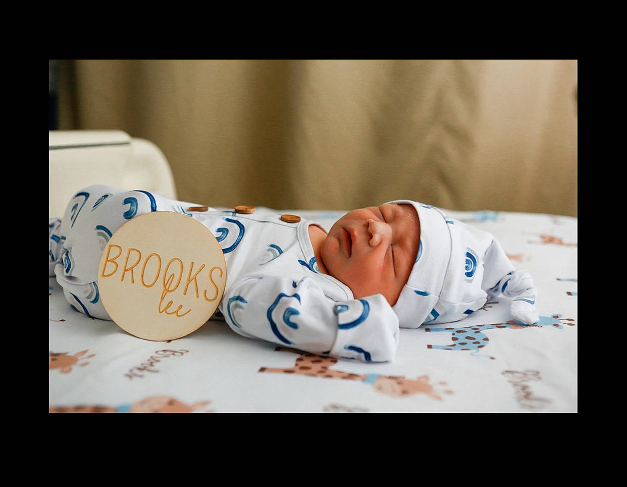 Brooks is registered to the contest to win money with this photo: baby, baby_toddler_clothing, bedtime, child, comfort, event, eye, fashion_accessory, flash_photography, flooring, font, hand, happy, head, headwear, human_body, linens, person, portrait_photography, sitting