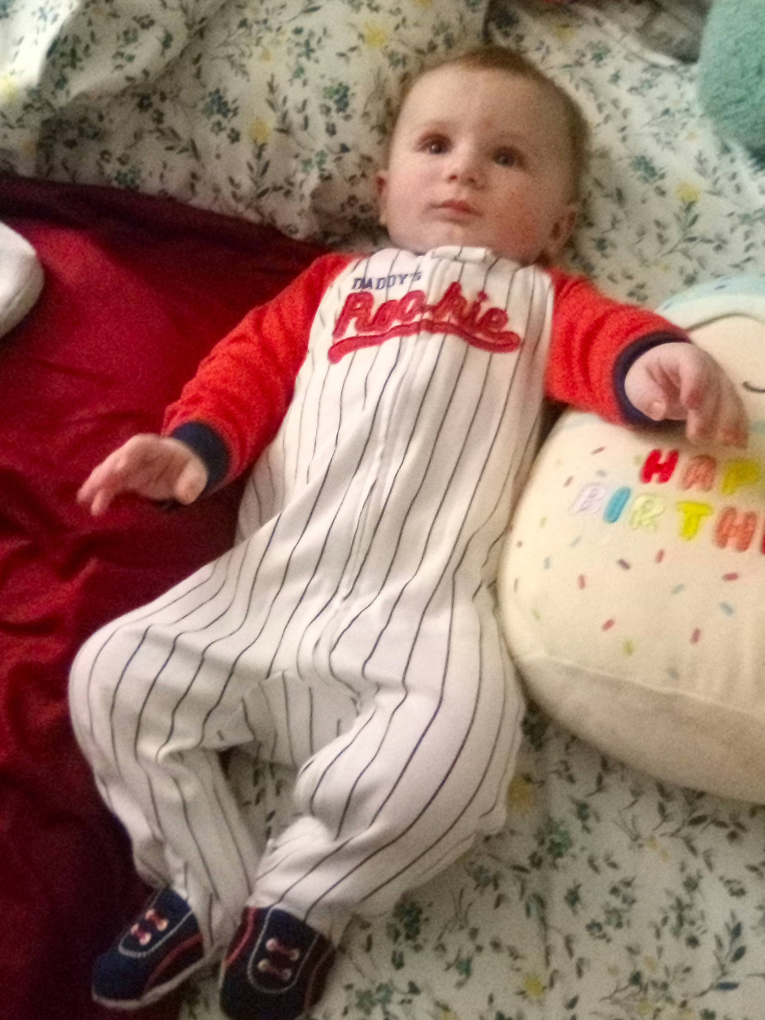 Billy is registered to the contest to win money with this photo: baby, baby_products, baby_toddler_clothing, bedding, carmine, cheek, child, comfort, couch, face, happy, head, lap, linens, person, pillow, sitting, sleeve, textile, throw_pillow