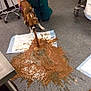 dog, vomiting, mess, veterinary_clinic, medical_staff, floor, spill, brown_liquid, absorbent_pad, leash, harness, rolling_cart, tile_floor, indoor, cleanup, animal_patient, puddle, distressed, dramatic_action, gloved_hand