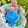 Greyson is registered to the contest to win money with this photo: baby, basket, blanket, blue, bunny, child, cute, easter, egg, face, grass, happy, infant, outdoor, plush, smile, soft, toy, young, yellow