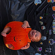 Camila joined the competition — help win amazing prizes! baby, pumpkin, halloween, costume, smile, face, black_background, stickers, decorations, orange, cute, holiday, child, festive, happy, sitting, celebration, indoors, joyful, hollow_pumpkin