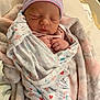 Camila joined the competition — help win amazing prizes! newborn, baby, sleeping, swaddled, blanket, hat, infant, cute, peaceful, soft, cozy, wrapped, child, indoors, portrait, headwear, resting, small_hands, fabric, patterned
