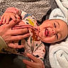 Rylei joined the competition — help win amazing prizes! baby, infant, child, laughing, smiling, portrait, indoor, blanket, towel, onesie, clothing, hands, adult, parent, lying_down, couch, cozy, happy, family, photography