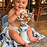 Rylei is registered to the contest to win money with this photo: baby, child, infant, smiling, sitting, portrait, indoor, toy, sensory_toy, colorful, rattan_furniture, wooden_floor, blanket, chair, diaper, barefoot, playtime, happy, face, home