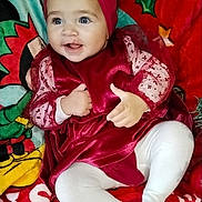 Abby a rejoint le concours — aidez-le/la à gagner de superbes lots ! baby, blanket, child, christmas, cozy, cute, face, feet, hands, happy, headband, holiday_theme, indoors, infant, portrait, red_dress, sitting, smiling, toddler, white_tights