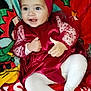 baby, blanket, child, christmas, cozy, cute, face, feet, hands, happy, headband, holiday_theme, indoors, infant, portrait, red_dress, sitting, smiling, toddler, white_tights