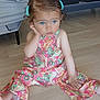 blue_eyes, casual, child, curly_hair, cute, expression, fashion, flooring, hair_clips, indoor, paisley_pattern, person, pink_outfit, portrait, sitting, small_hand, thoughtful, toddler, wooden_floor, young_child