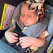 Brynleigh joined the competition — help win amazing prizes! baby, sleeping, car_seat, headband, leopard_print, infant, child, safety_strap, cute, peaceful, hands, clothing, seat, transportation, portrait, young_child, comfort, resting, indoors, closeup