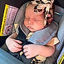 baby, sleeping, car_seat, headband, leopard_print, infant, child, safety_strap, cute, peaceful, hands, clothing, seat, transportation, portrait, young_child, comfort, resting, indoors, closeup