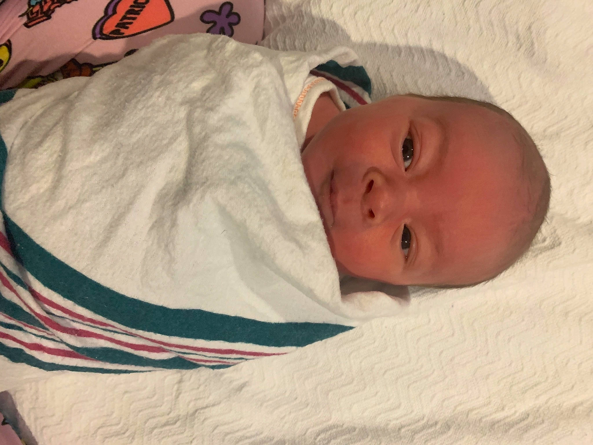 Izaiah is registered to the contest to win money with this photo: baby, baby_products, baby_safety, baby_toddler_clothing, bedding, bedtime, child, comfort, eyebrow, head, headgear, linens, person, room, sleep, sleeve, smile, toddler, towel