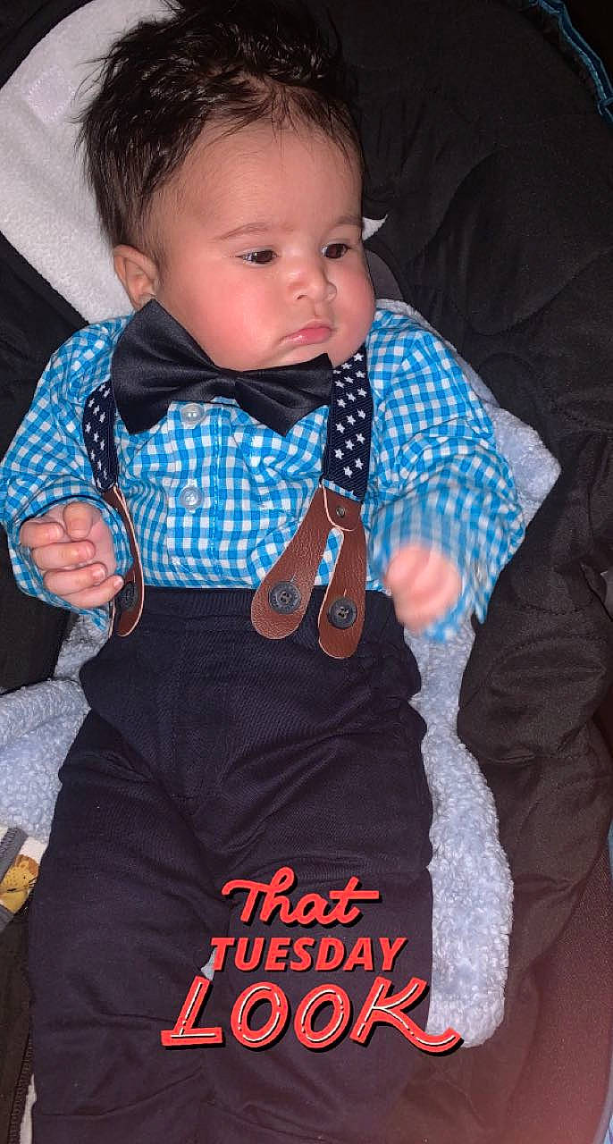 Carlos is registered to the contest to win money with this photo: baby, baby_products, baby_toddler_clothing, black, cheek, child, collar, cool, electric_blue, face, finger, formal_wear, pattern, person, sitting, skin, sleeve, t_shirt, textile, thumb
