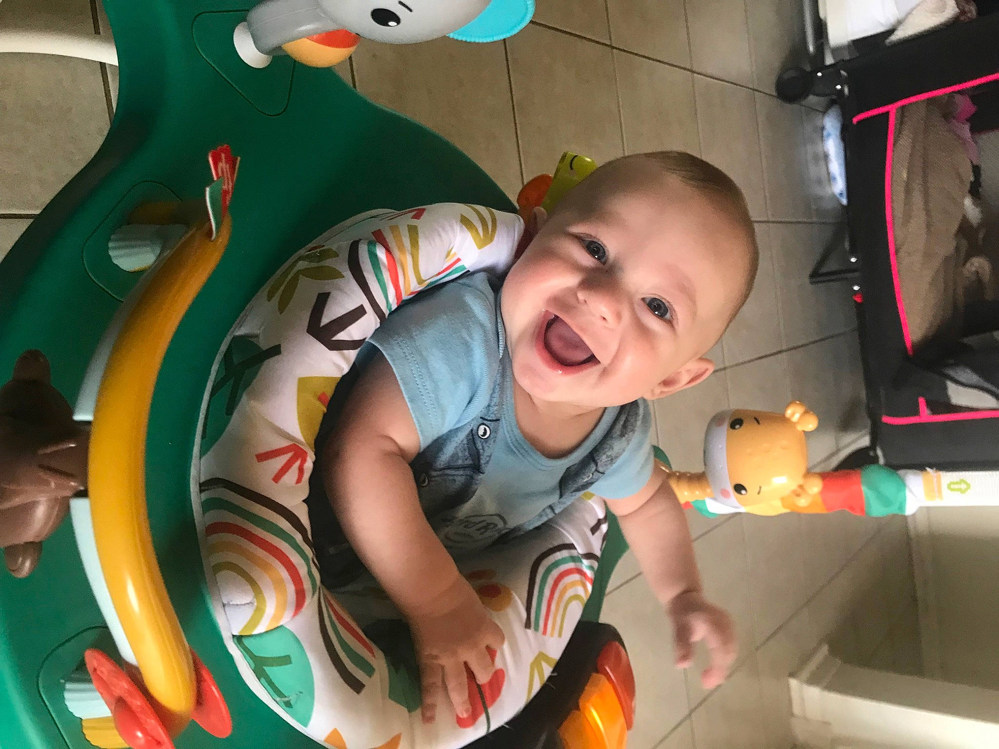 Jesse James is registered to the contest to win money with this photo: baby, baby_products, baby_toddler_clothing, baby_toys, child, circle, fun, happy, laugh, leisure, mouth, organ, person, play, room, sitting, smile, t_shirt, toddler, toy