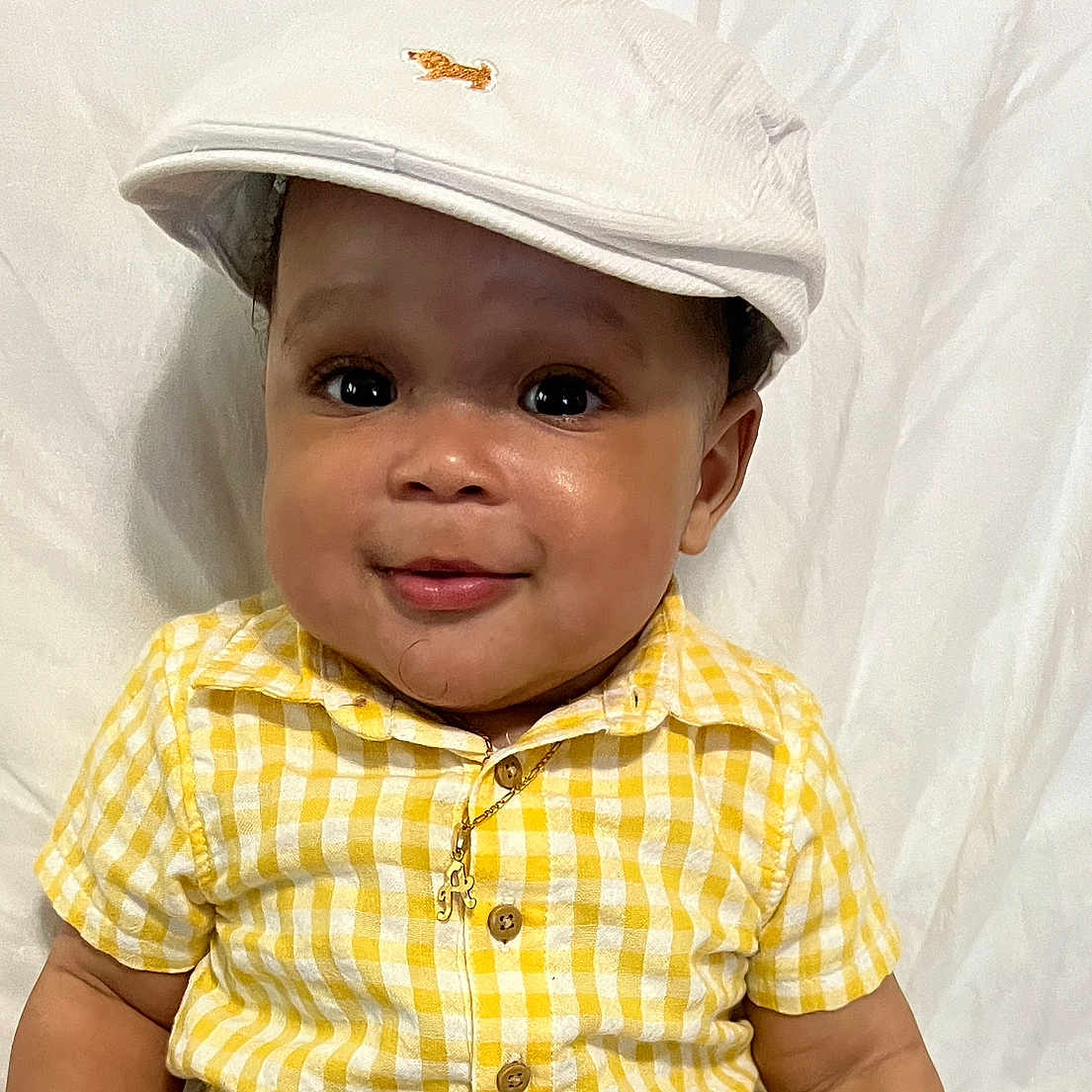 Amari joined the competition — help win amazing prizes! baby, baseballcap, beachwear, bodypart, bonnet, cap, clothing, face, happy, hat, head, person, photography, portrait, shirt, shoulder, sleeve, smile, sunhat, t_shirt