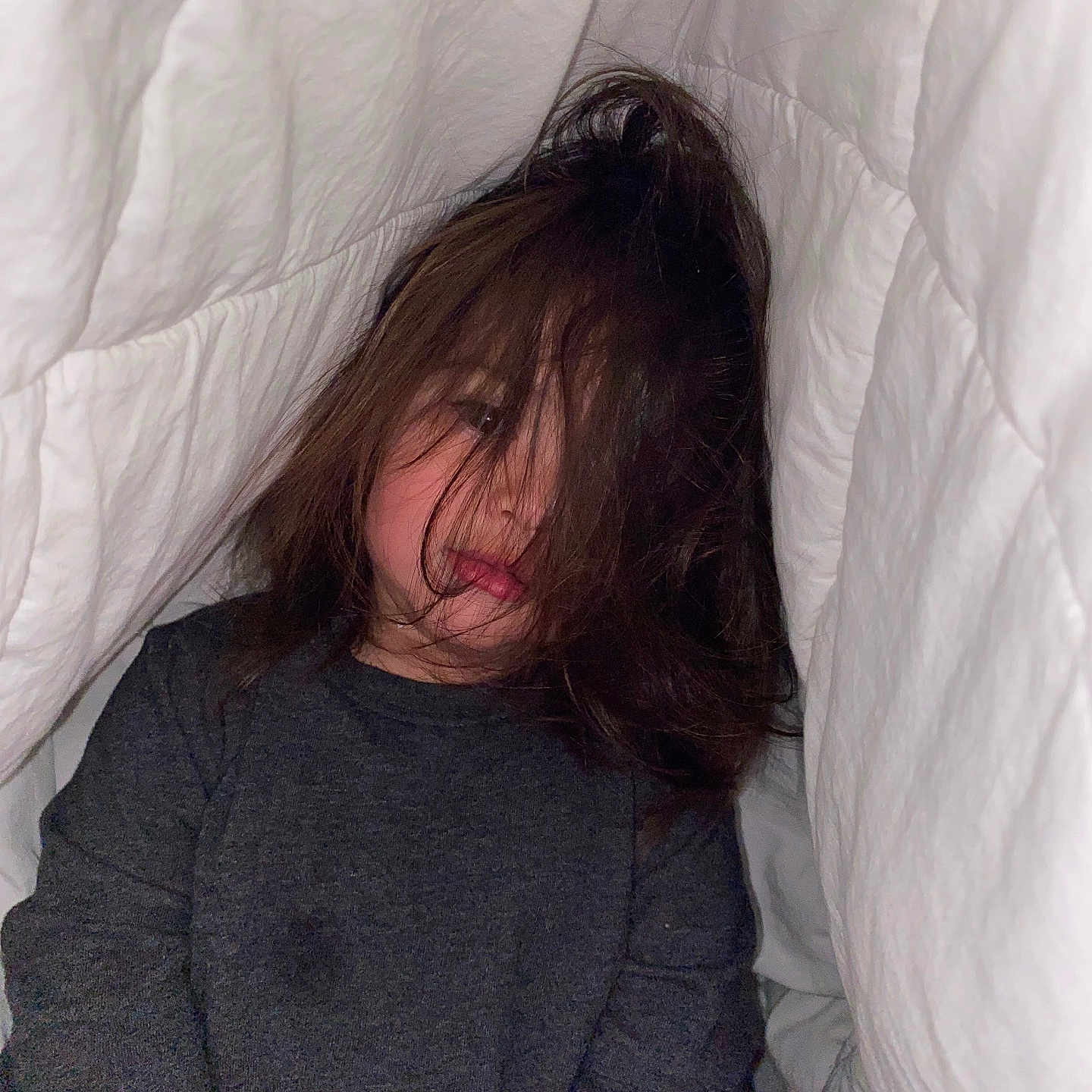 Asly joined the competition — help win amazing prizes! blanket, casual_clothing, child, childhood, cozy, cute, dark_shirt, expression, face, hair, home, indoors, intimate, messy_hair, portrait, relaxed, sitting, soft_lighting, white_bedding, young_child