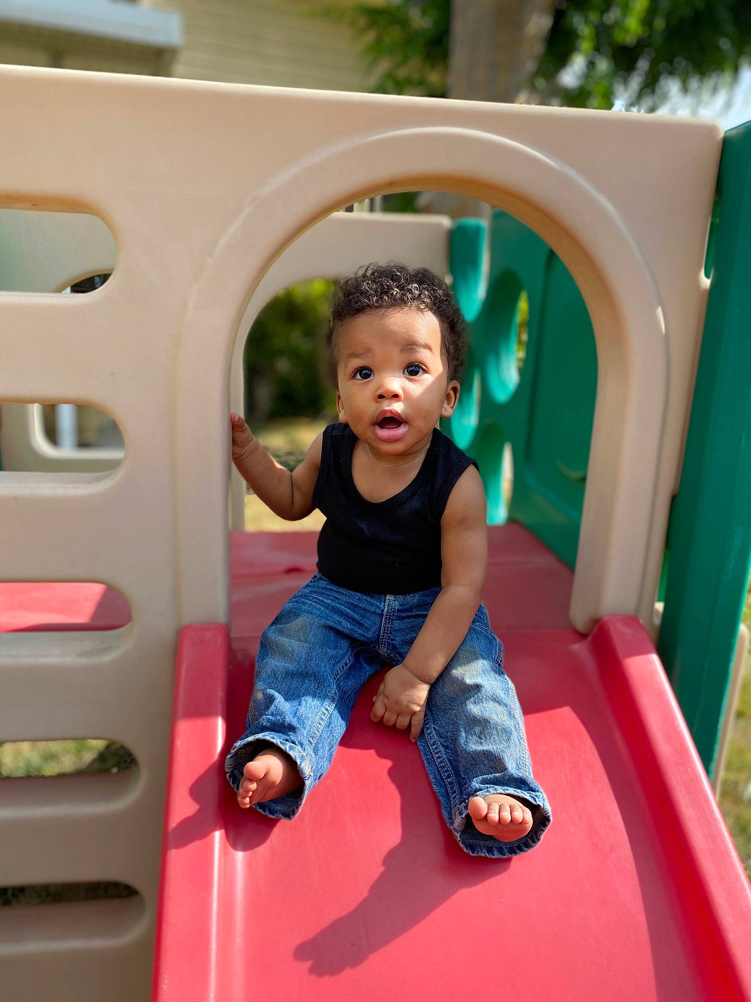 Brannon is registered to the contest to win money with this photo: child, fun, human_settlement, leisure, outdoor_play_equipment, person, pink, play, playground, playground_slide, public_space, recreation, surprise, toddler