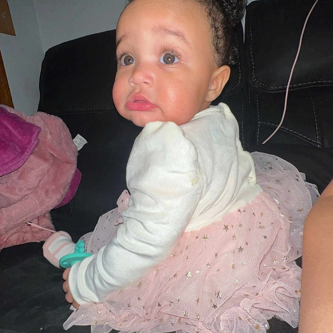 A'Veah Rae joined the competition — help win amazing prizes! architecture, baby, bodypart, building, clothing, couch, cushion, dress, face, finger, furniture, hand, head, homedecor, indoors, livingroom, person, photography, portrait, sitting