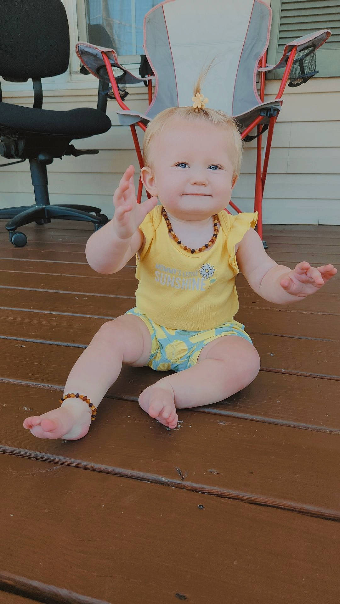 Jada is registered to the contest to win money with this photo: baby, baby_toddler_clothing, barefoot, child, flooring, foot, fun, happy, hardwood, human_leg, leisure, person, pink, sitting, smile, thigh, toddler, wood