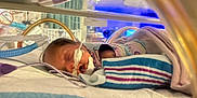 Nalani joined the competition — help win amazing prizes! newborn, baby, incubator, hospital, medical_equipment, blanket, sleeping, tubes, healthcare, patient, neonatal, care, cute, infant, bed, monitor, wrapped, quiet, indoors, resting