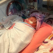 Nalani joined the competition — help win amazing prizes! newborn, baby, incubator, hospital, medical_tubes, blanket, headband, pink_pillow, sleeping, patient, healthcare, infant, swaddled, medical_equipment, nursery, cute, child, peaceful, resting, portrait