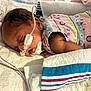 Nalani is registered to the contest to win money with this photo: baby, newborn, sleeping, medical_tubes, hospital, blanket, onesie, infant, face, healthcare, rest, child, cute, patient, soft, lying_down, delicate, tender, young, care