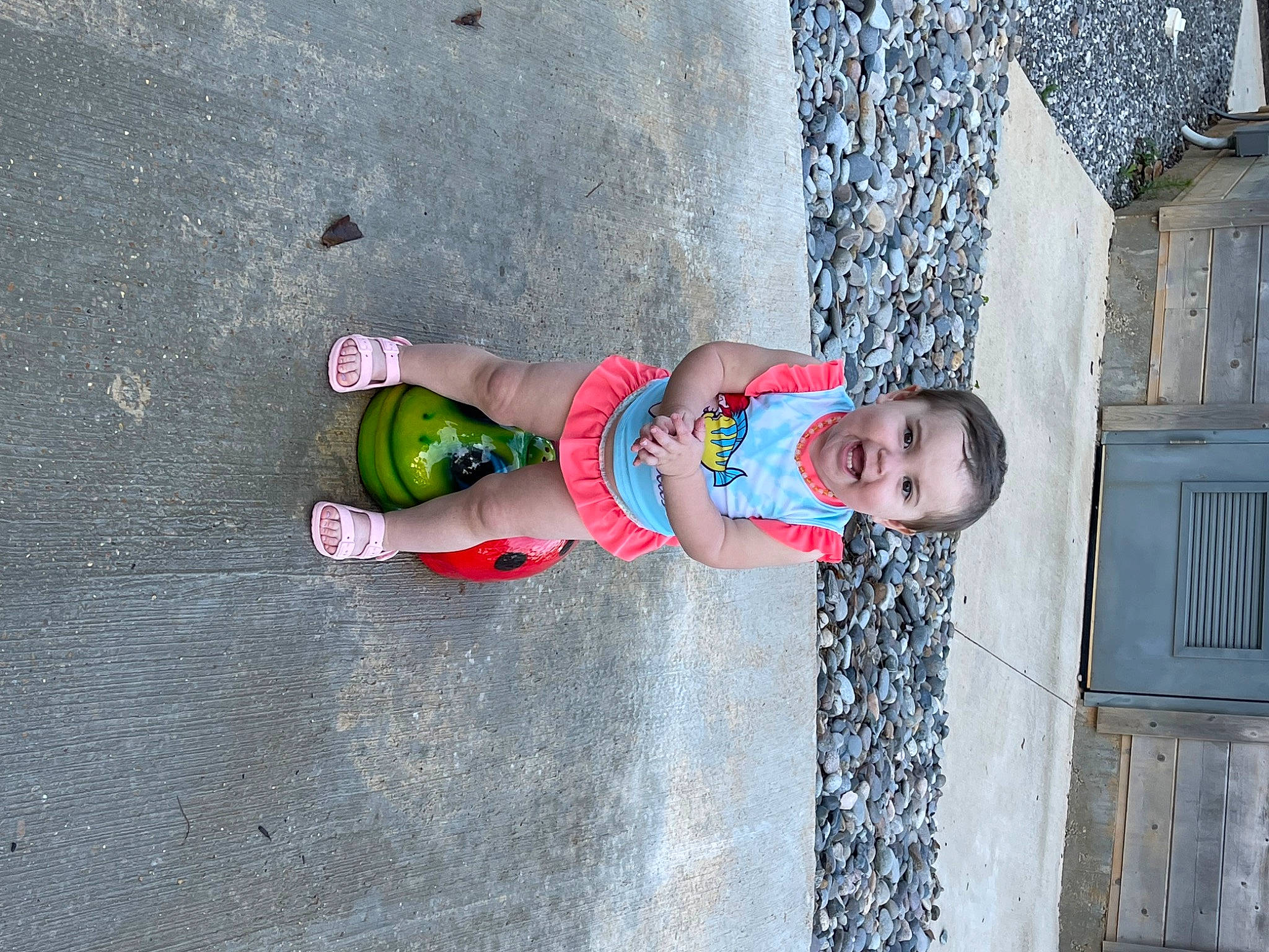 Kara Anne joined the competition — help win amazing prizes! asphalt, carmine, child, concrete, foot, fun, human_leg, leisure, pattern, people_in_nature, person, recreation, road_surface, sandal, shadow, sidewalk, smile, street, thigh, toddler