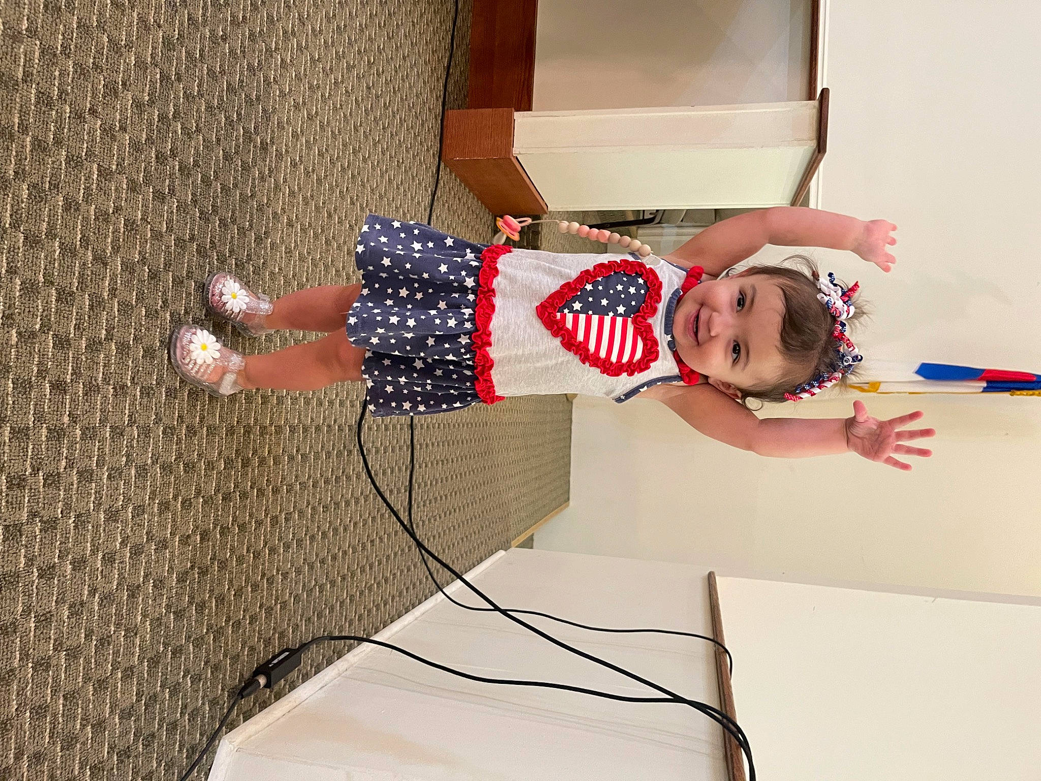 Olivia Claire is registered to the contest to win money with this photo: cable, child, elbow, electrical_supply, electrical_wiring, floor, flooring, fun, hardwood, human_leg, joy, knee, pattern, person, room, sandal, sock, thigh, toddler, wire