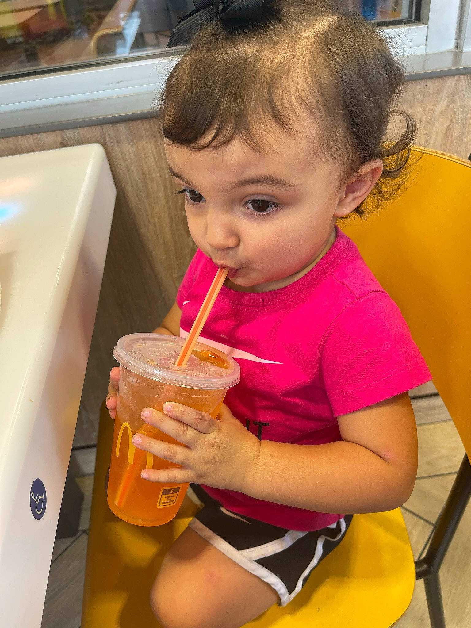 Olivia Claire joined the competition — help win amazing prizes! chair, child, drink, drinking, drinking_straw, face, food, food_craving, fun, hand, juice, non_alcoholic_beverage, person, shorts, smoothie, snapshot, sweetness, t_shirt, table, tableware