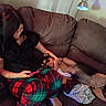 Bandit joined the competition — help win amazing prizes! barefoot, black_shirt, blanket, brown_dog, casual, comfort, couch, cozy, dog, furniture, home, indoor, lamp, living_room, person, petting, plaid_pants, relaxed, resting, seated