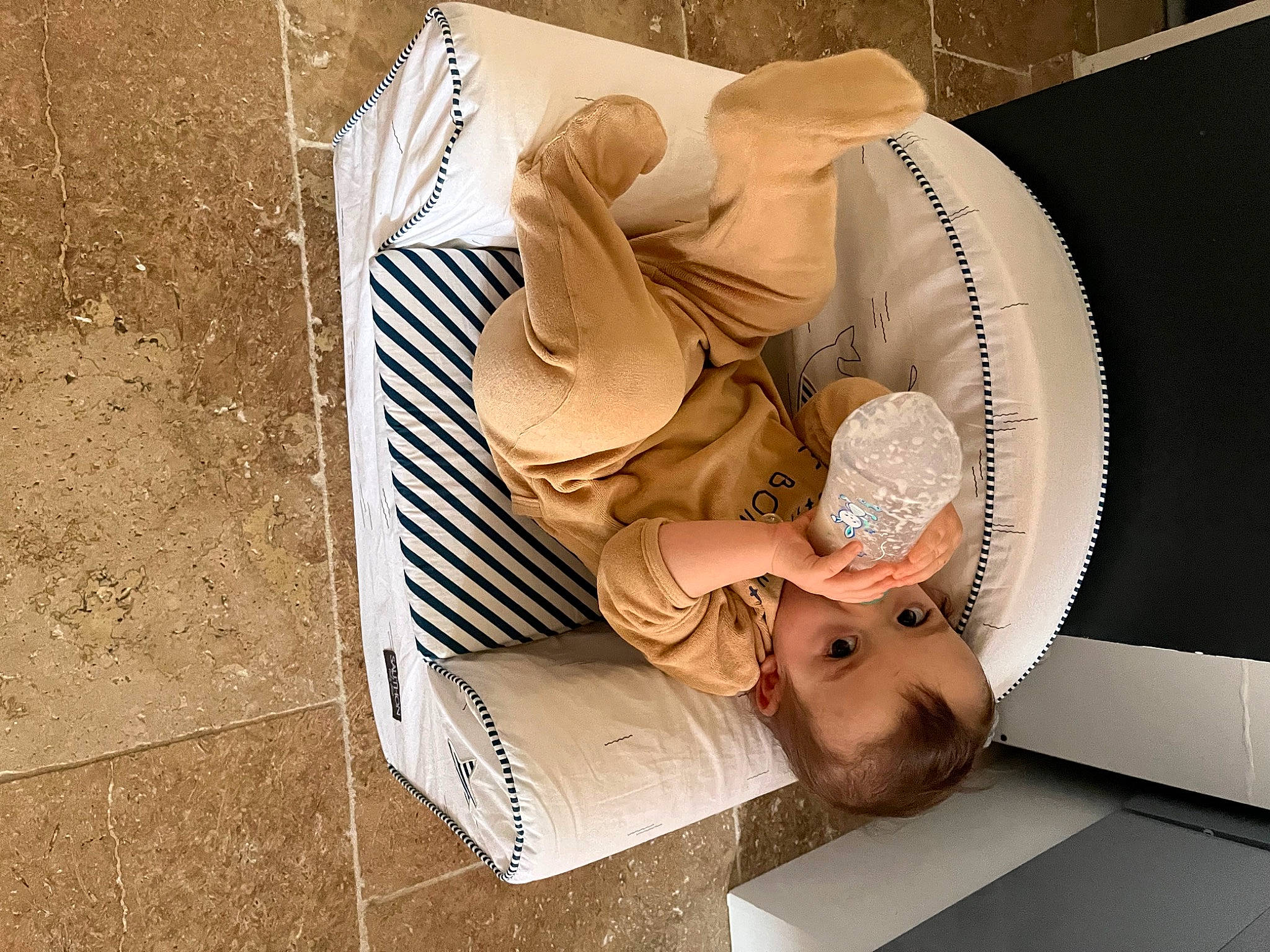 Mylo participe au concours pour gagner de l'argent avec cette photo : art, baby, child, circle, comfort, font, linens, nap, paper, paper_product, person, room, visual_arts, wood