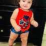 baby, ball, baseball, baseballball, bodypart, cabinet, clothing, drawer, face, footwear, furniture, head, pants, person, photography, portrait, shoe, shorts, sport, t_shirt