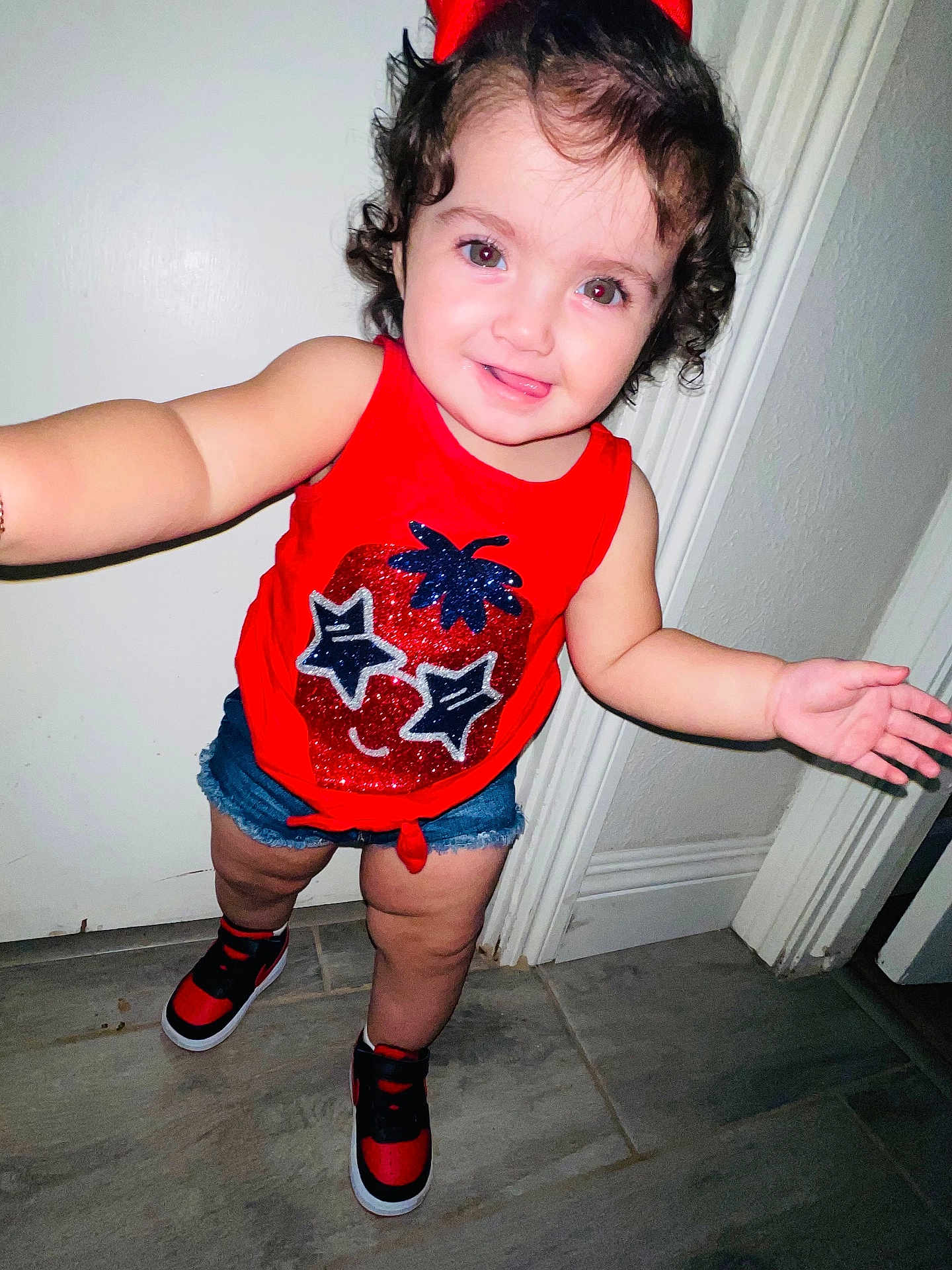 Kendra is registered to the contest to win money with this photo: baby, bodypart, clothing, costume, door, face, finger, footwear, hand, head, jeans, pants, person, photography, portrait, sandal, shoe, shorts, sneaker, t_shirt