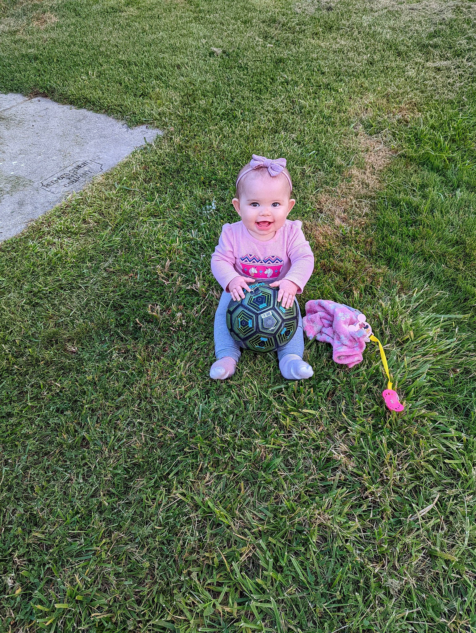 Madisyn joined the competition — help win amazing prizes! baby, baby_toddler_clothing, child, fun, garden, grass, grassland, groundcover, happy, landscape, lawn, magenta, meadow, people_in_nature, person, plant, sitting, smile, soil, toddler