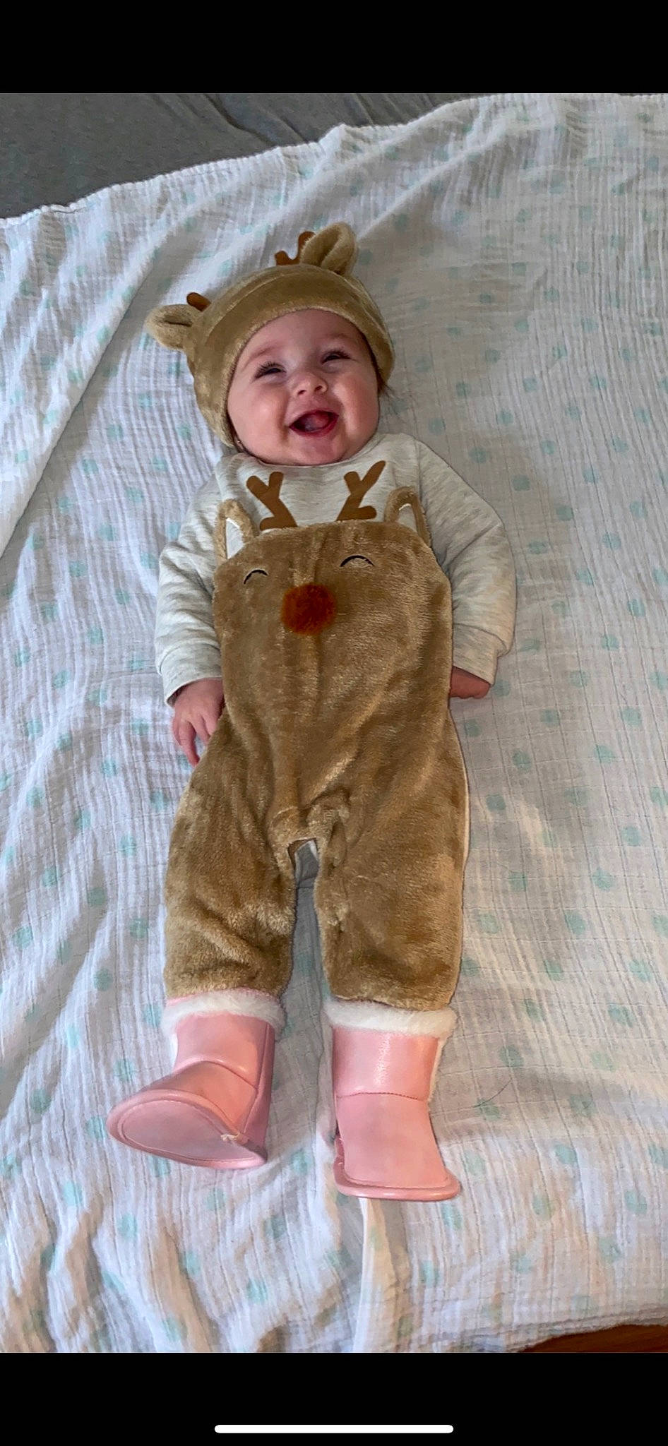 Mallory is registered to the contest to win money with this photo: baby, baby_toddler_clothing, baby_toys, cheek, child, face, fawn, fur, head, headwear, joy, leg, linens, pattern, peach, person, pink, skin, sleeve, smile