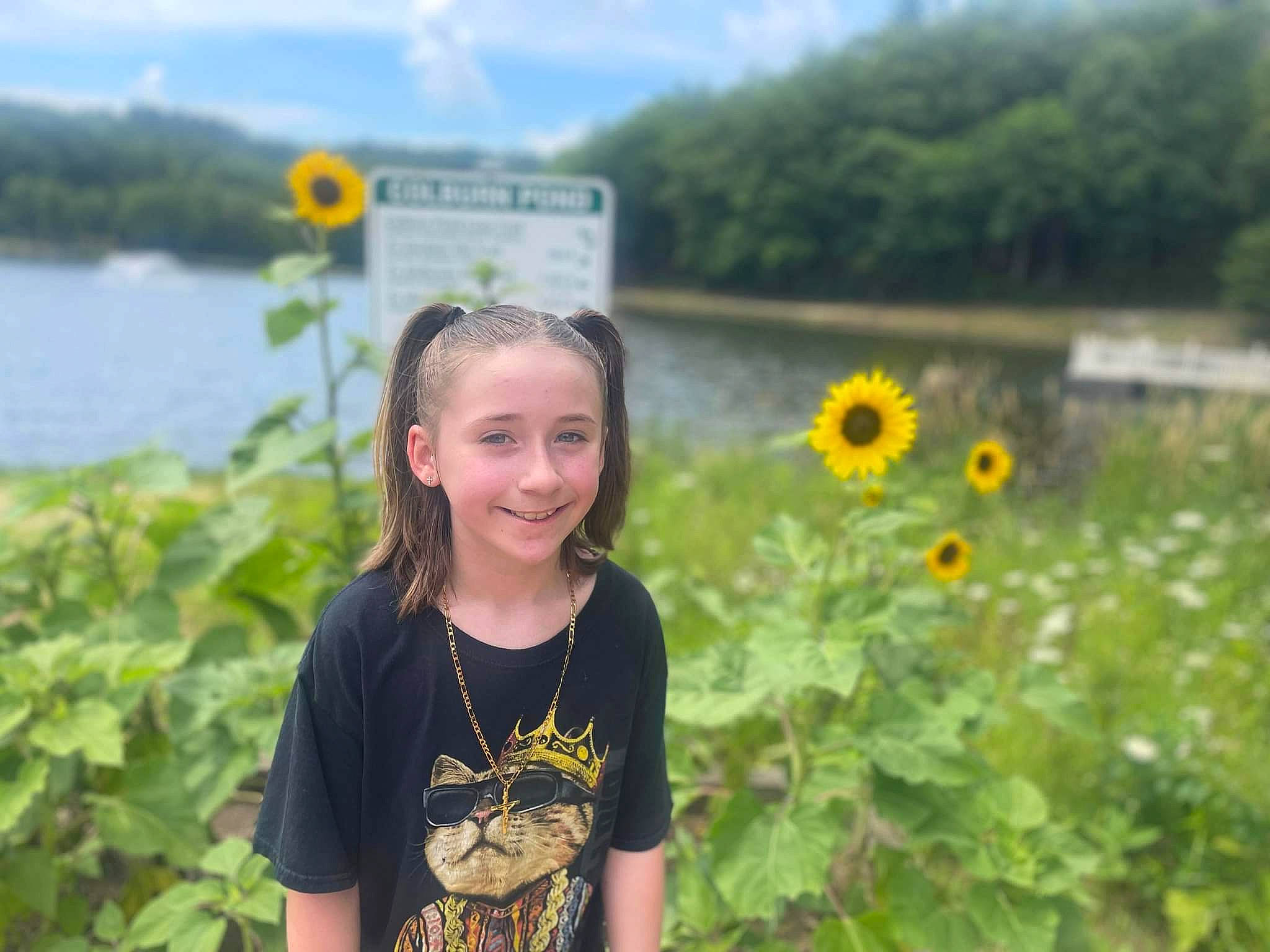 Laura is registered to the contest to win money with this photo: botany, flower, grass, happy, iris, joy, lake, landscape, morning, natural_environment, natural_landscape, nature, people_in_nature, person, plant, sky, smile, summer, travel, vegetation